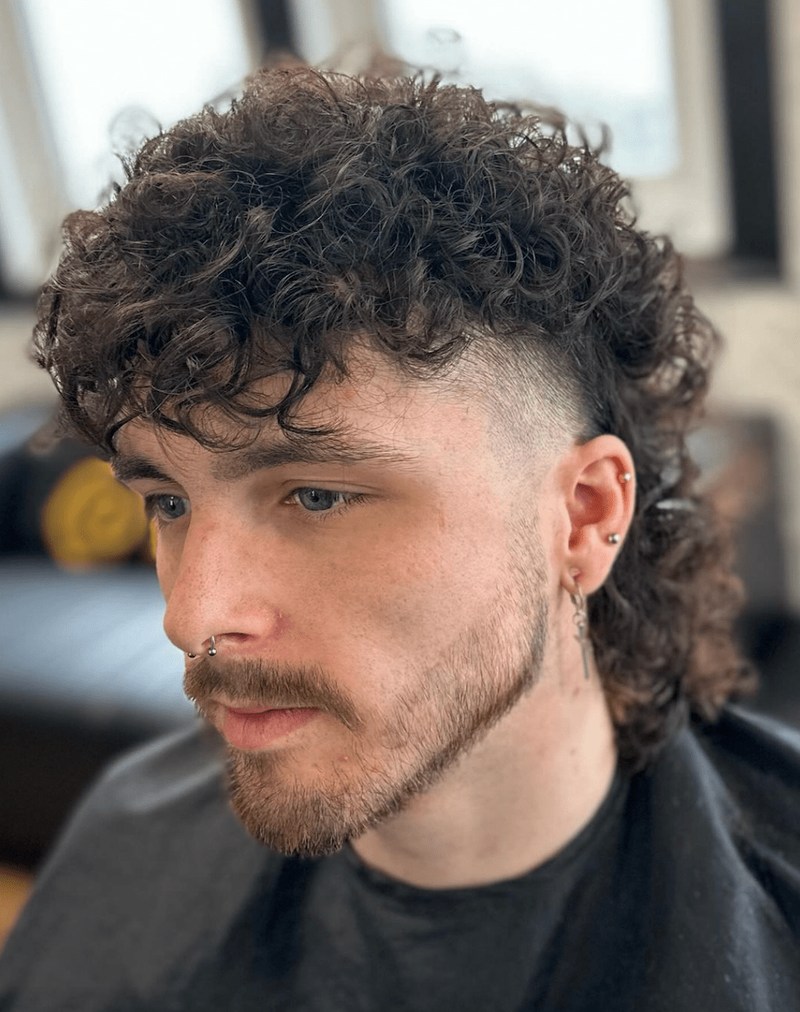 Burst Fade Mexican Mullet - curly top, burst fade sides, mullet back length.