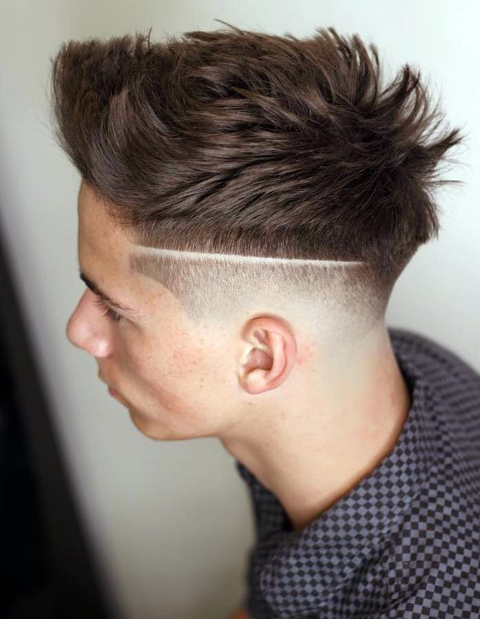Classic Low Drop Fade: Textured, voluminous top with sharp, clean fade line and smooth skin fade on sides.