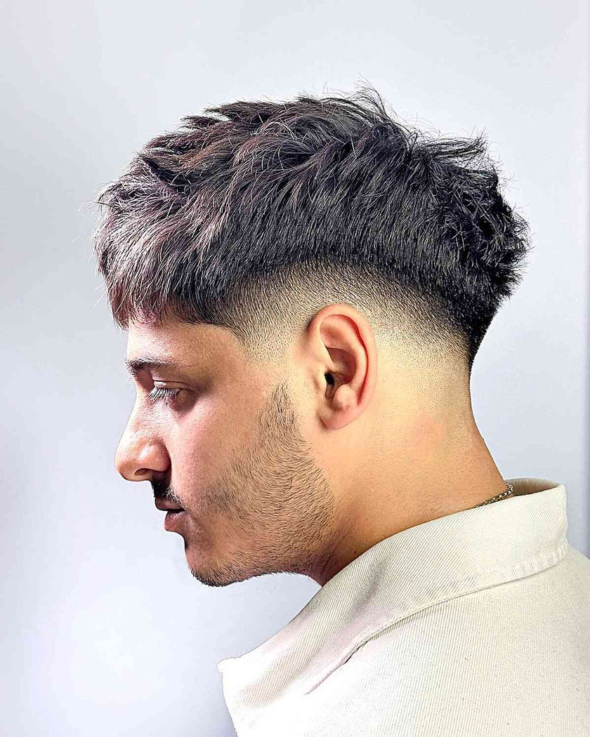 Drop fade with thick, straight Asian/Korean hair texture; textured top, clean fade, sharp contrast.
