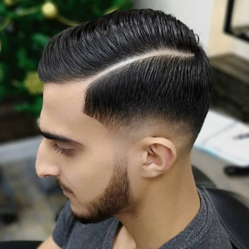 Mid Drop Fade Comb Over: Sleek, defined comb-over with mid fade, sharp part line, textured top, clean tapered sides.