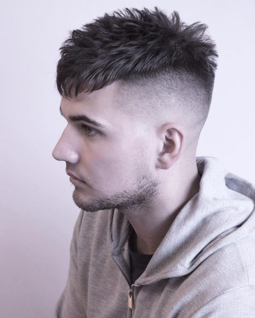 Zero Drop Fade with Clean Crown: textured, spiky top; sharp, gradual fade; seamless crown blending, smooth upper transition.
