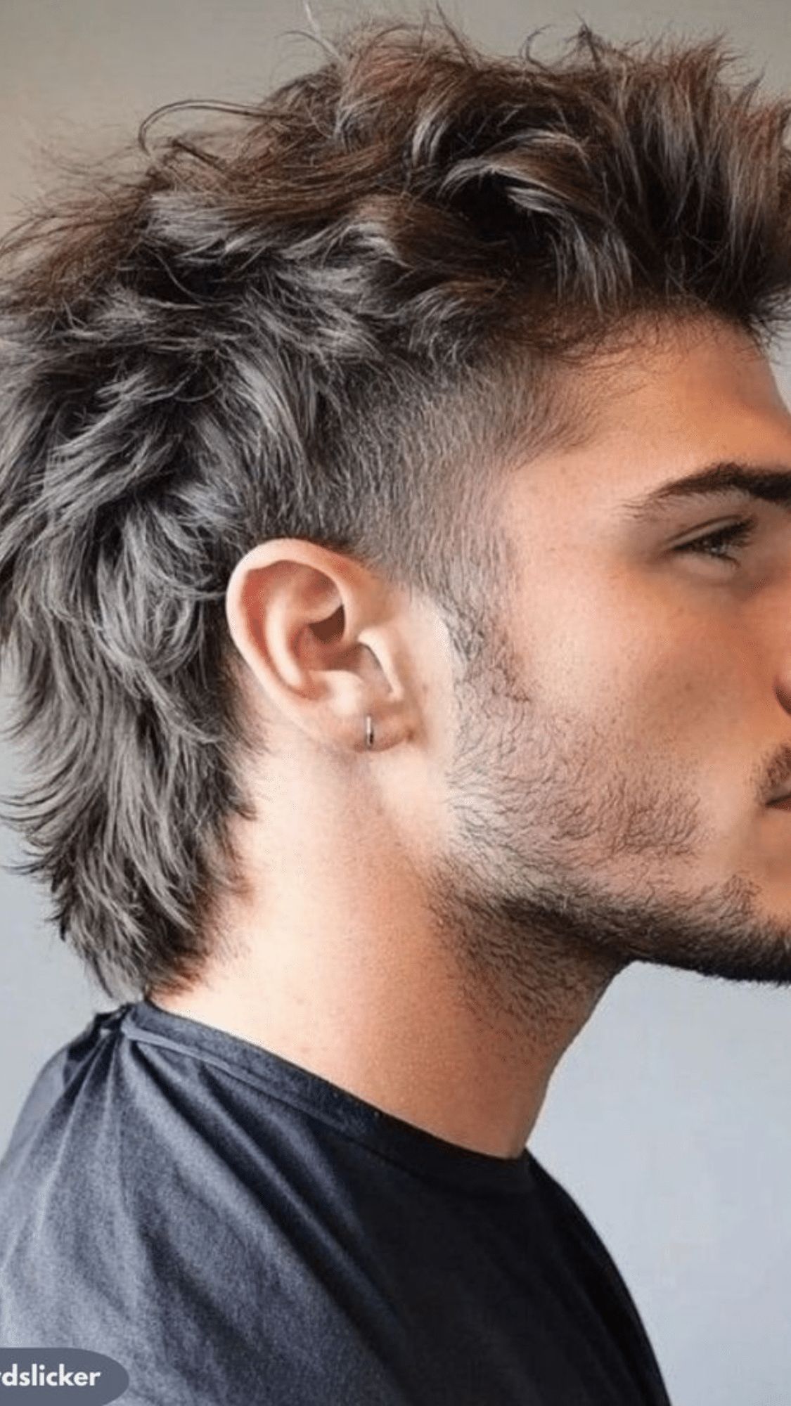 Short, textured, voluminous top with a sharp fade on the sides.